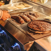 Multiple heat zones of the Estate 30 enable backyard chefs to cook a variety of meat and vegetables to precision.