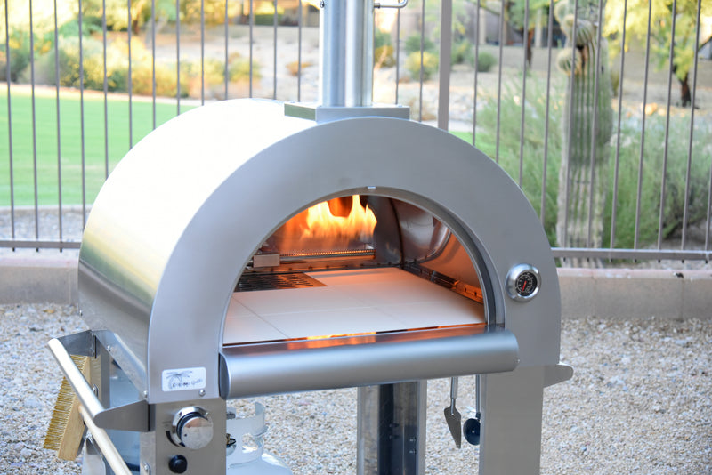 Close-up front view (door open with flames visible) of the KoKoMo Dual-Fuel Pizza Oven
