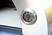 Built-in temperature gauge/thermometer on the face of the Kokomo dual-fuel oven enables precise heat control.