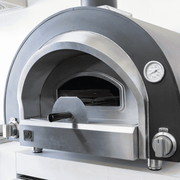 Summerset Hybrid Oven provides the soul of wood-fired cooking with the ease of gas precision. This commercial-grade pizza oven is perfect for artisan pizzas, fire-roasted dishes, and freshly baked bread. 