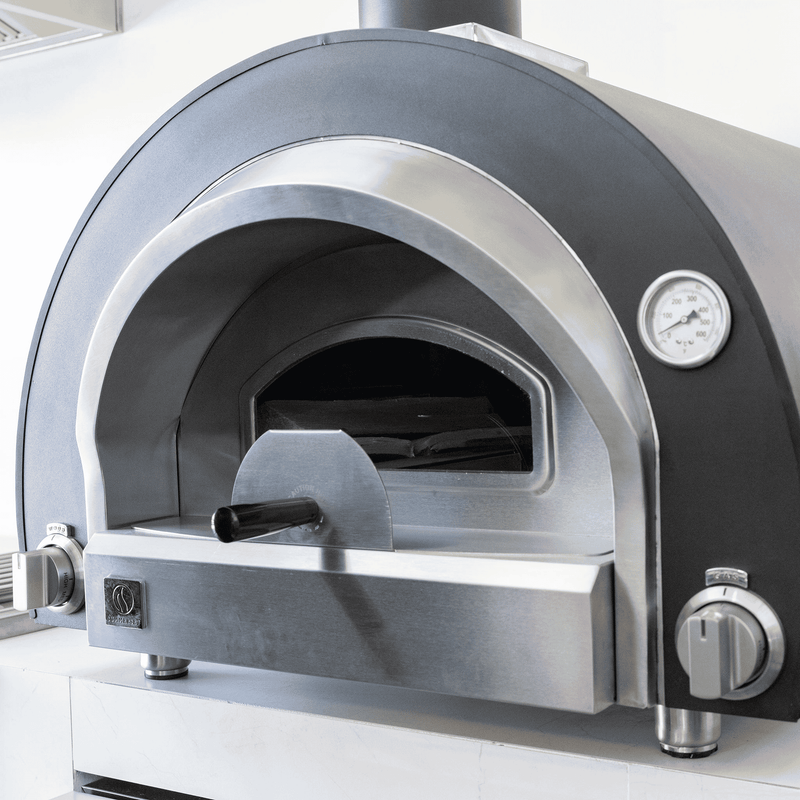 Summerset Hybrid Oven provides the soul of wood-fired cooking with the ease of gas precision. This commercial-grade pizza oven is perfect for artisan pizzas, fire-roasted dishes, and freshly baked bread. 