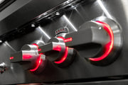 LED-lit control knobs glow red when burners are on so you always know which zones are fired up at a glance.