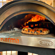 Thick stone floor and real wood flame deliver crispy, leopard‑spotted Neapolitan crusts in minutes