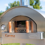 Wide doorway with cool-touch handles gives you confident control when launching pies and managing the fire.